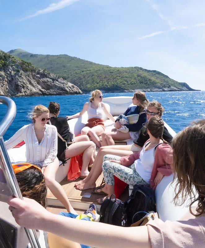 Photo of a group of girls during a boat trip to Grama Bay, Vlore, Albania